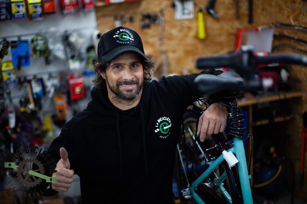 PHOTO-2019-04-29-13-53-48 a man holding a bycicle